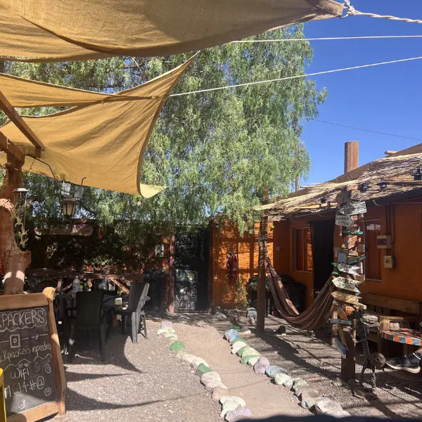 Relaxing outdoor seating area at Backpackers Hostel San Pedro de Atacama